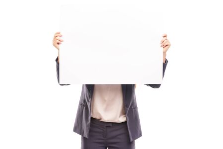 Businesswoman holding blank sheet of paper on white backgroundの写真素材