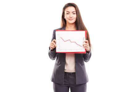 Portrait of female financial advisor posing with document on white backgroundの写真素材