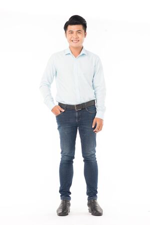 Portrait of confident Asian man wearing shirt and jeans posing on white backgroundの写真素材