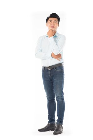 Studio portrait of young Asian man expressing emotions on white backgroundの写真素材