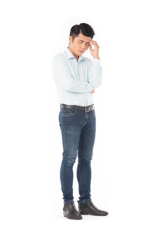 Studio portrait of young Asian man expressing emotions on white backgroundの写真素材