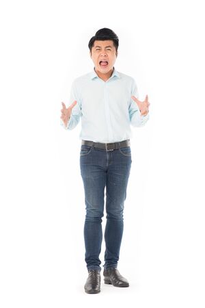 Studio portrait of young Asian man expressing emotions on white backgroundの写真素材