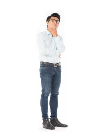 Portrait of young Asian businessman wearing eyeglasses on white backgroundの写真素材