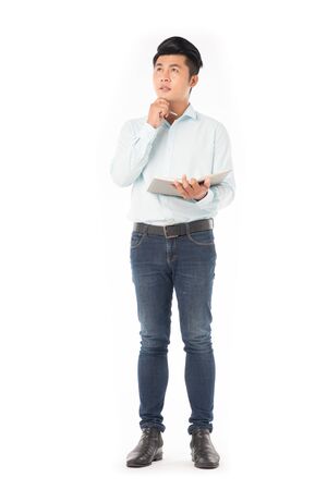 Portrait of adult Asian student holding notepadの写真素材