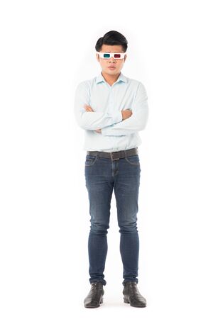 Portrait of young Asian man wearing 3d cinema glasses on white backgroundの写真素材