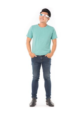 Portrait of young Asian man wearing 3d cinema glasses isolated on whiteの写真素材