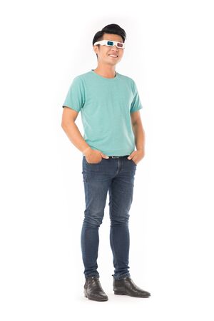 Portrait of young Asian man wearing 3d cinema glasses isolated on whiteの写真素材