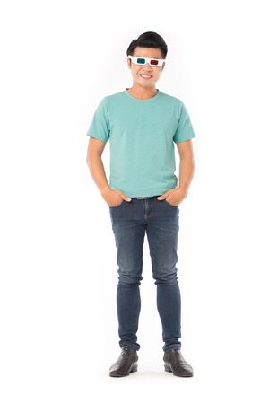 Portrait of young Asian man wearing 3d cinema glasses isolated on whiteの写真素材