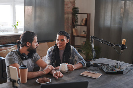 Horizontal portrait shot of modern multi-ethnic male and female influencers talking about something...
