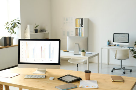Horizontal image of workplace of business person with computer in modern officeの写真素材