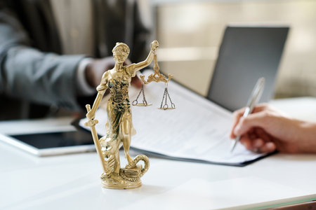 Close-up of Goddess of justice stnding on workplace of lawyer in officeの写真素材