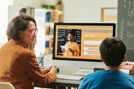 Side view portrait of female teacher explaining smart learning course to student using computer...