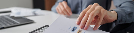 Header image of unrecognizable businesswoman taking documents with data statistics while working at...