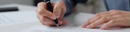 Header image of unrecognizable businesswoman signing contract in office with focus on female hand...
