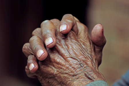 Nepalese Buddhist old man with hands in prayer positionの写真素材