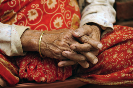 Old hands peasant woman in Kathmandu, Nepalの写真素材