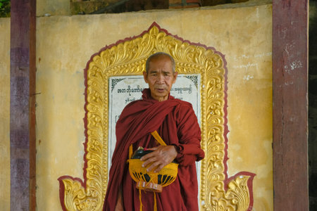 Mount Popa, Myanmar. September-04-2015 Buddhist monk asking for donations