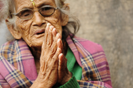 Patan, Nepal. August, 22, 2010 Poor nepali woman begging in Patanのeditorial素材