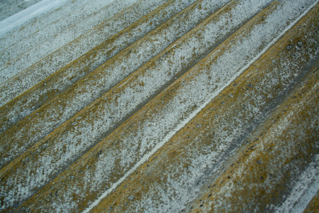 Old aged slate roof background. Rough slate with mossの写真素材