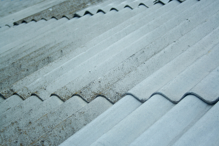 Old aged slate roof background. Rough slate with mossの写真素材