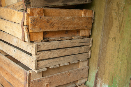 A stack of old scrawled wooden boxesの写真素材