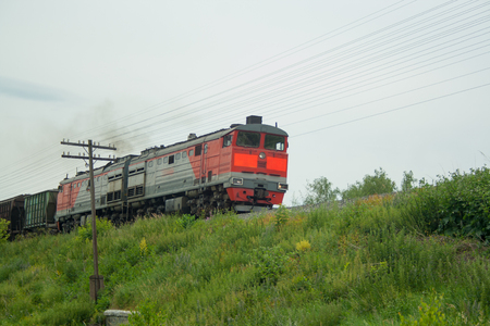 Old traveling Russian train in the fieldの写真素材