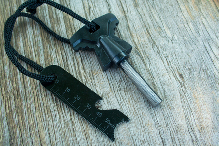 Flint and a brace tied with cord on a wooden backgroundの写真素材