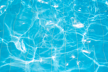 Blue surface of water shining on sun. Water reflectionsの写真素材