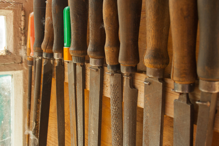 Several old dusty files hang in a rowの写真素材