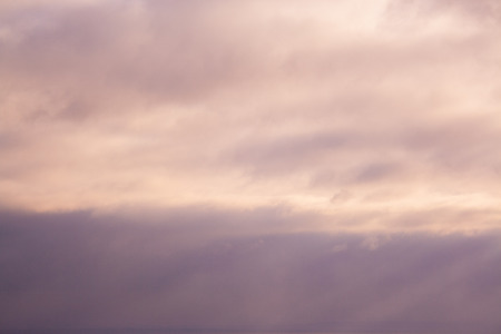 Cloudscape before rain background. Clouds pattern. Warm colorsの写真素材
