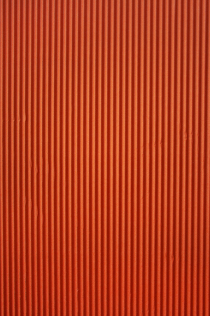 Red corrugated paper texture. Abstract red backgroundの写真素材