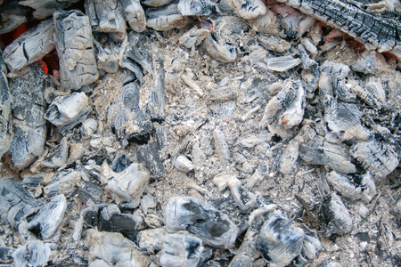 Fire, coals and ash close-up. Bonfire in the afternoonの写真素材