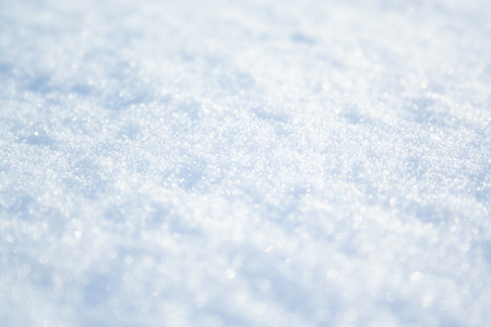 Snow surface background close up at sunny winter dayの写真素材