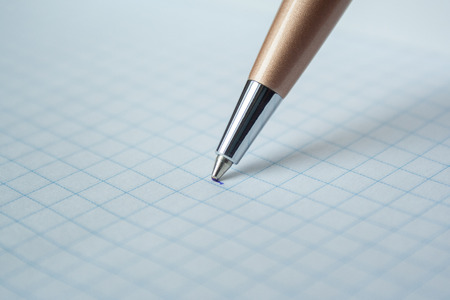 Pen and white notepad paper close upの写真素材