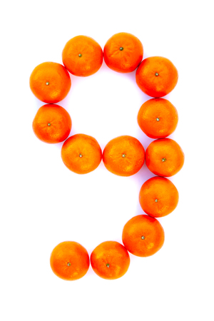 Number solved with tangerines isolated on white background. Mandarine number Â«9Â»の写真素材