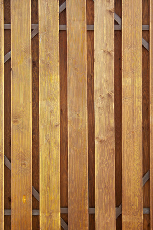 Old red painted wall texture background on sunの写真素材