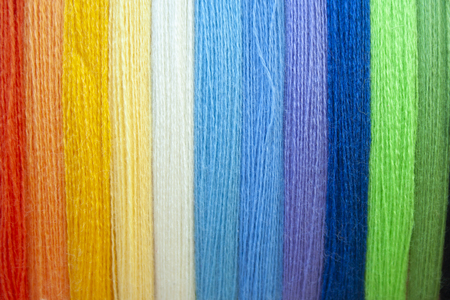 Many multi colored yarn strings for design background. Texture of colored thread. Concept of sewing, hobby image.の素材 [FY310121263876]