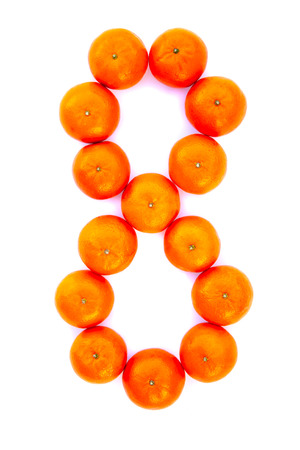 Number solved with tangerines isolated on white background. Mandarine number Â«8Â»の写真素材