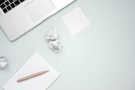 Work and creativity concept. Laptop, notepad, crumpled paper and pen top view flat lay photo with copyspace. Computer and paper work. Office equipmentの写真素材
