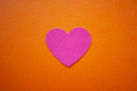 Love, valentines day, mothers day, women concept. Small paper heart shape on blue background top...