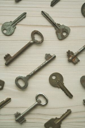 Top view of many old rusty keys background. Many keys Access, security, enter, choice, solutions of problems concept, symbol. Verticalの写真素材