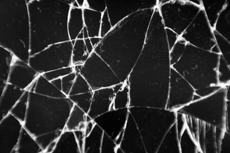 Broken glass texture. Abstract of cracked phone screen. Smartphone broken cracked glass texture of display screen. Abstract backgroundの写真素材