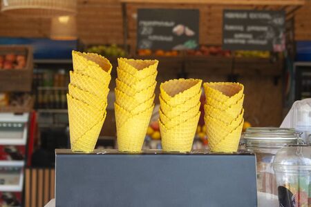 Ice cream cones on street ice cream shop in summer day. Ice cream cones. Fresh ice cream, summer food, coldの写真素材