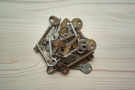 Close up heap of old rusty grunge keys top view. Many keys Access, security, enter, choice,...