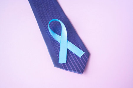 Prostate Cancer Awareness, light Blue Ribbon on blue men tie for support people living and illness....