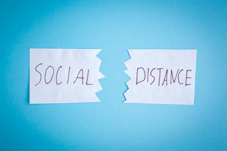 Two pieces of paper lie next to each other with inscription quote social distance. The concept of...