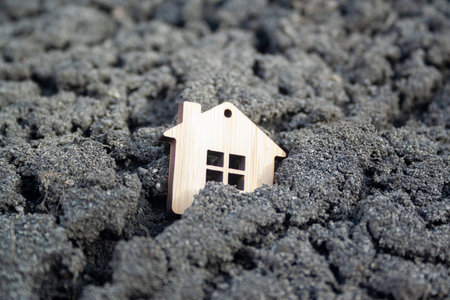 Miniature wooden toy house standing