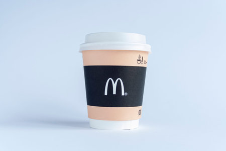 paper cup of McDonalds Coffee on white background.