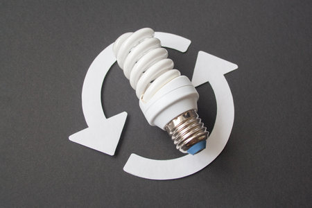 Energy saving light bulb on a black backgroundの写真素材