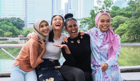 Cheerful women embracing each otherの写真素材